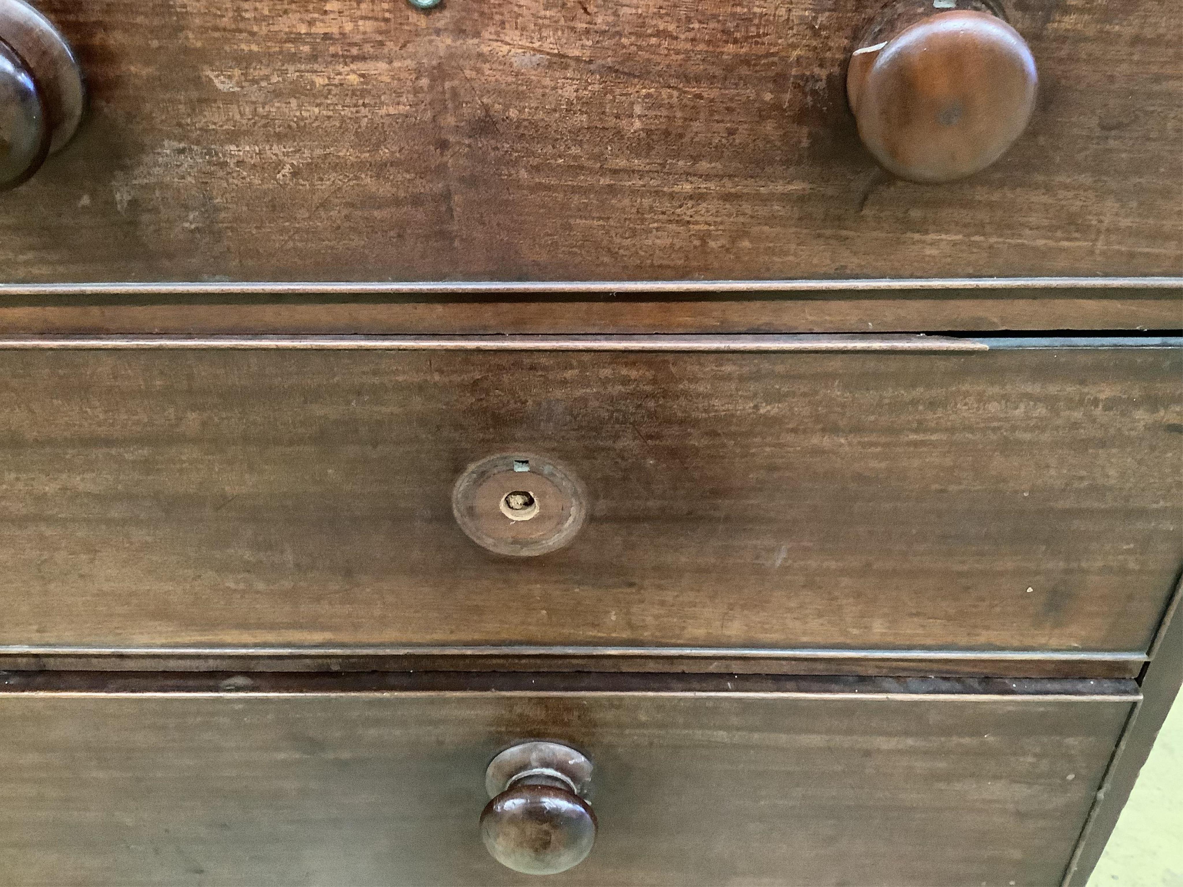 A George III mahogany linen press, the top retaining the original sliding trays, width 129cm, depth 56cm, height 201cm. Condition - poor